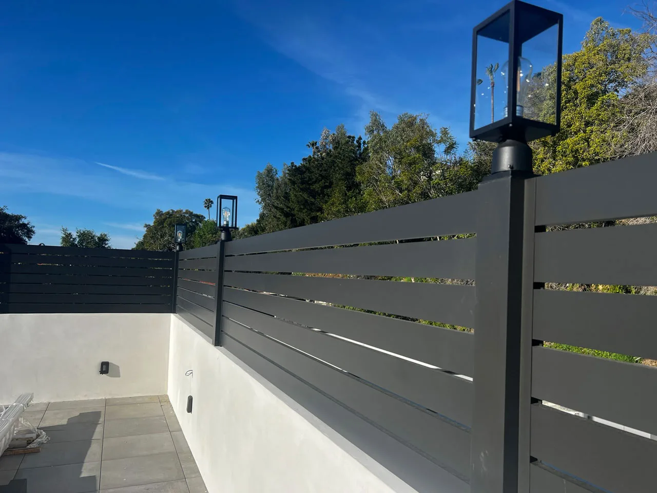 Elite L.A. Patios - The Modern Look of Aluminum Fencing: A Homeowner’s Guide - modern aluminum fence with lighting